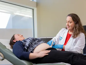 Dr. Morales giving an ultrasound to a pregnant patient
