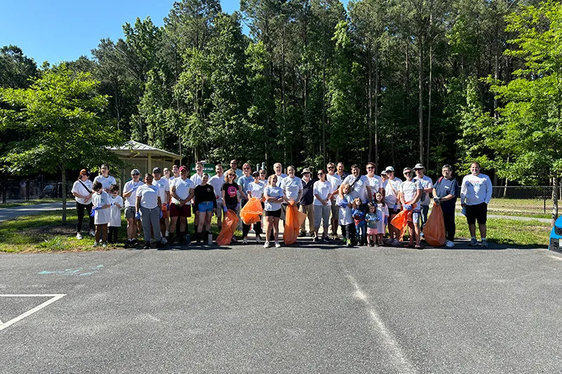 group of volunteers in a parking lot