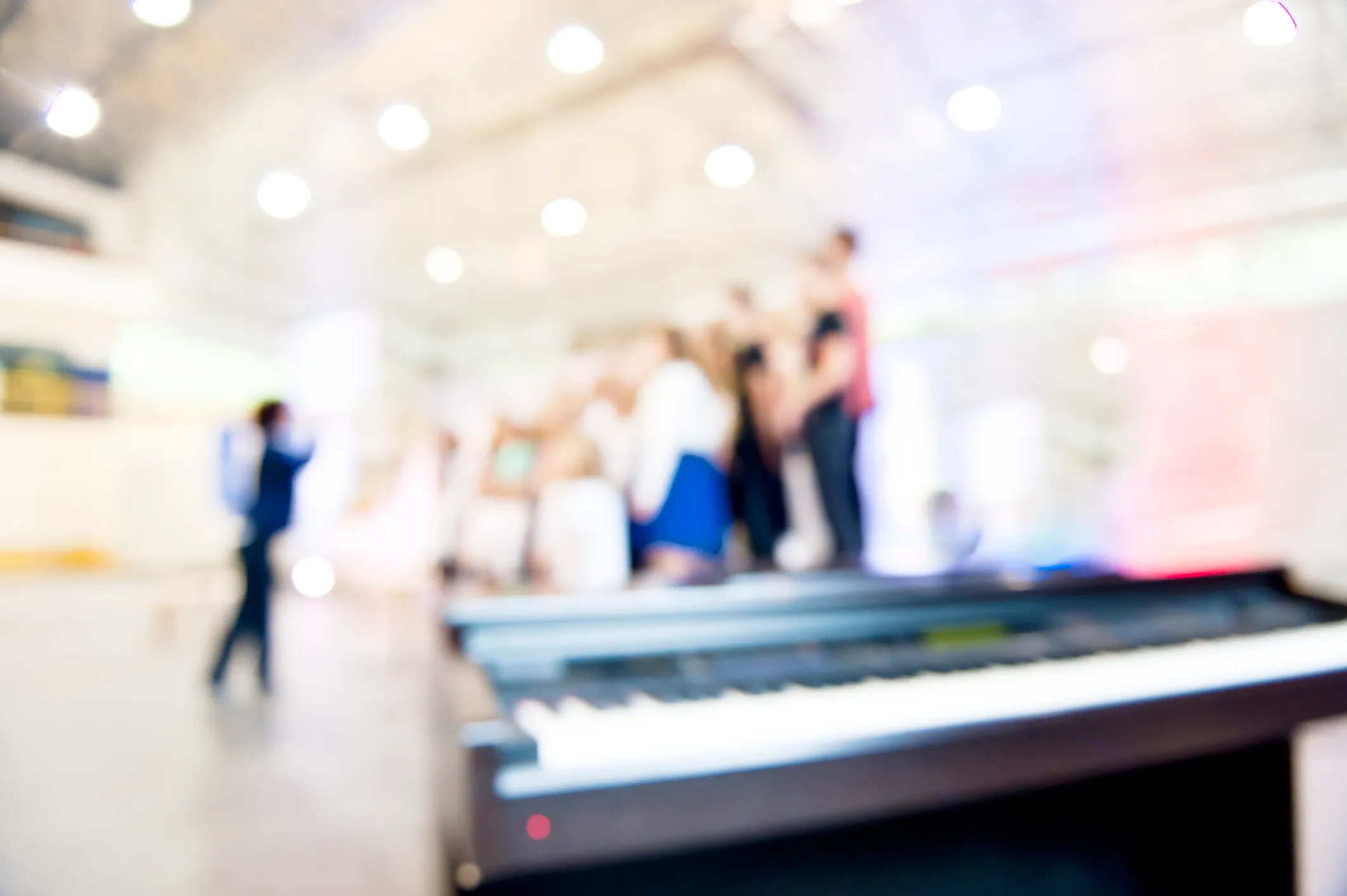 Community choir with keyboard in foreground