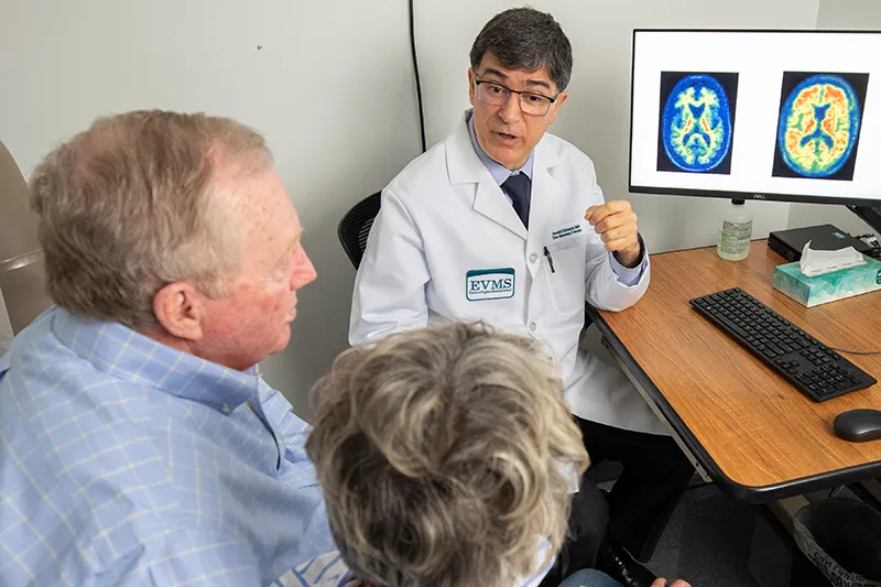 Doctor sitting with patients