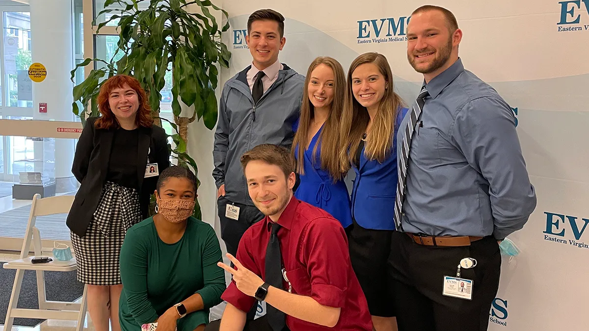 students posing for a photo on campus