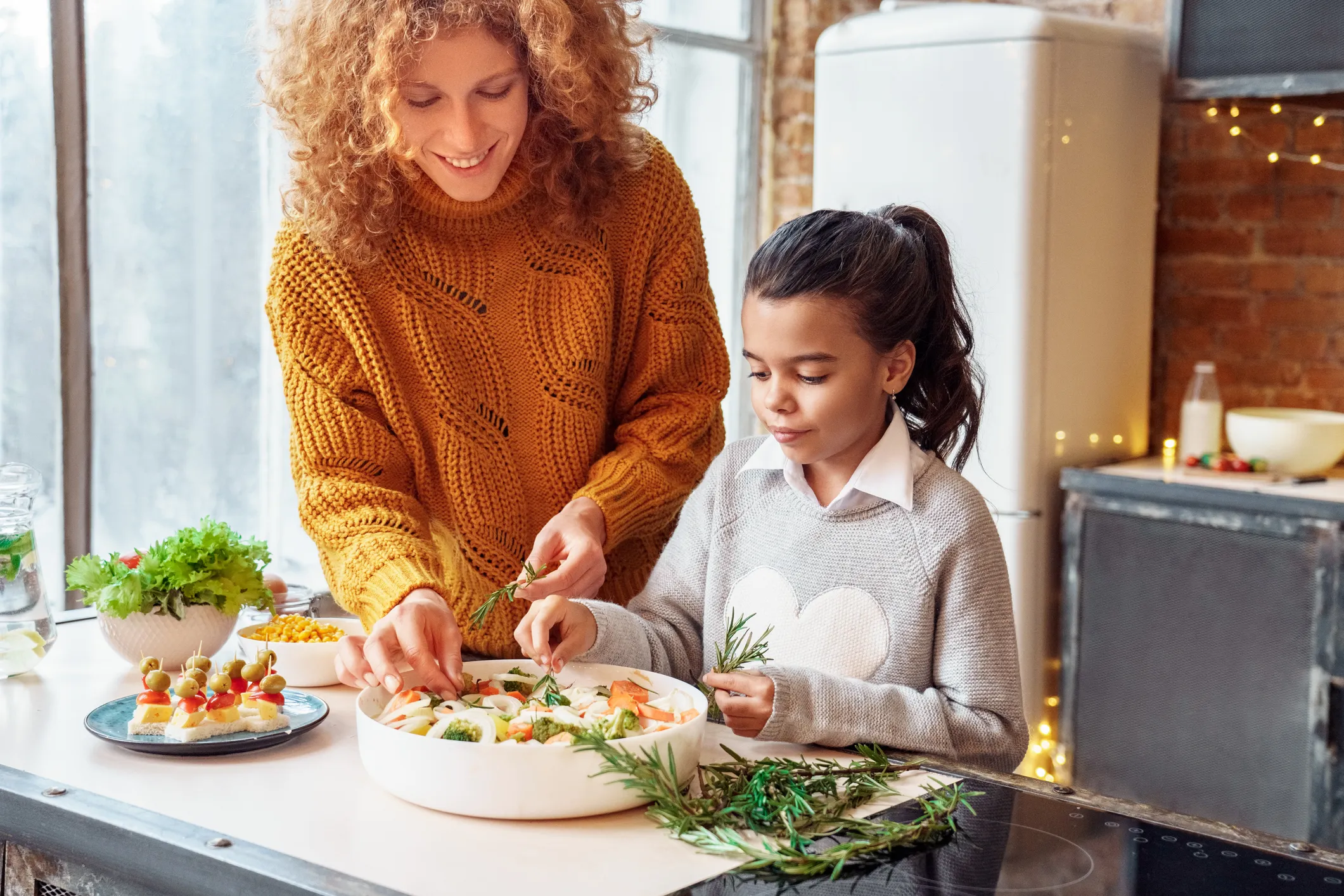 Woman and child making a salad