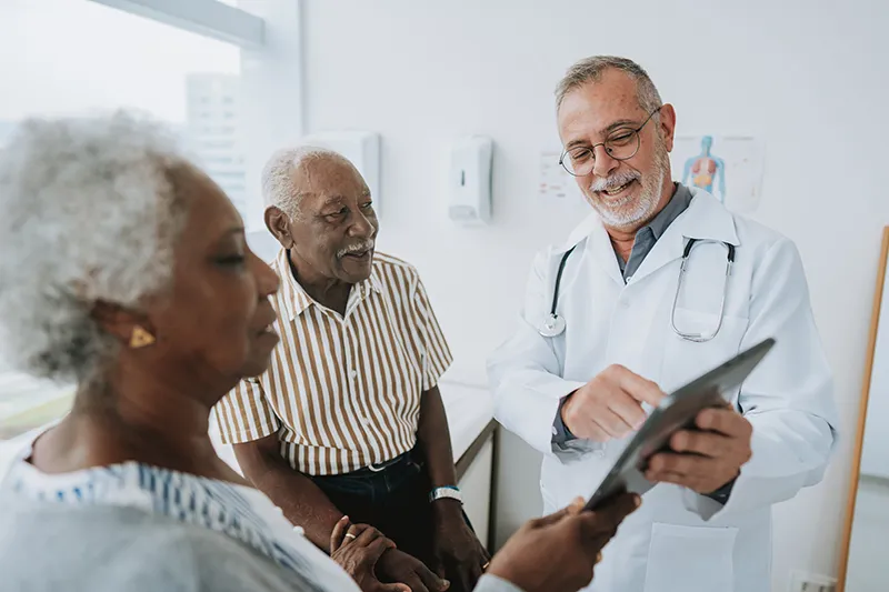 patient looking at a chart with a doctor.