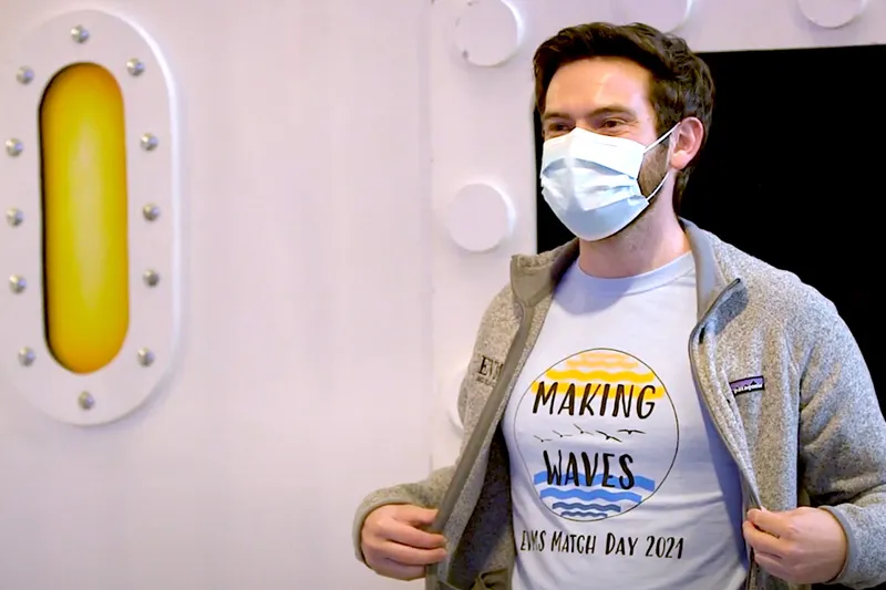 A student wearing a t-shirt that says 