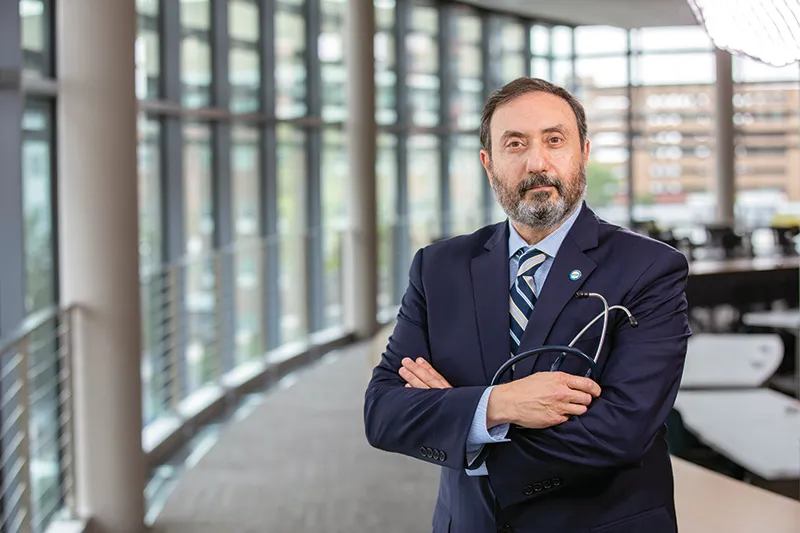 Dr. Abuhamad standing in Waitzer Hall.