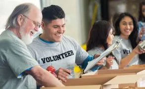 Volunteers working an assembly line