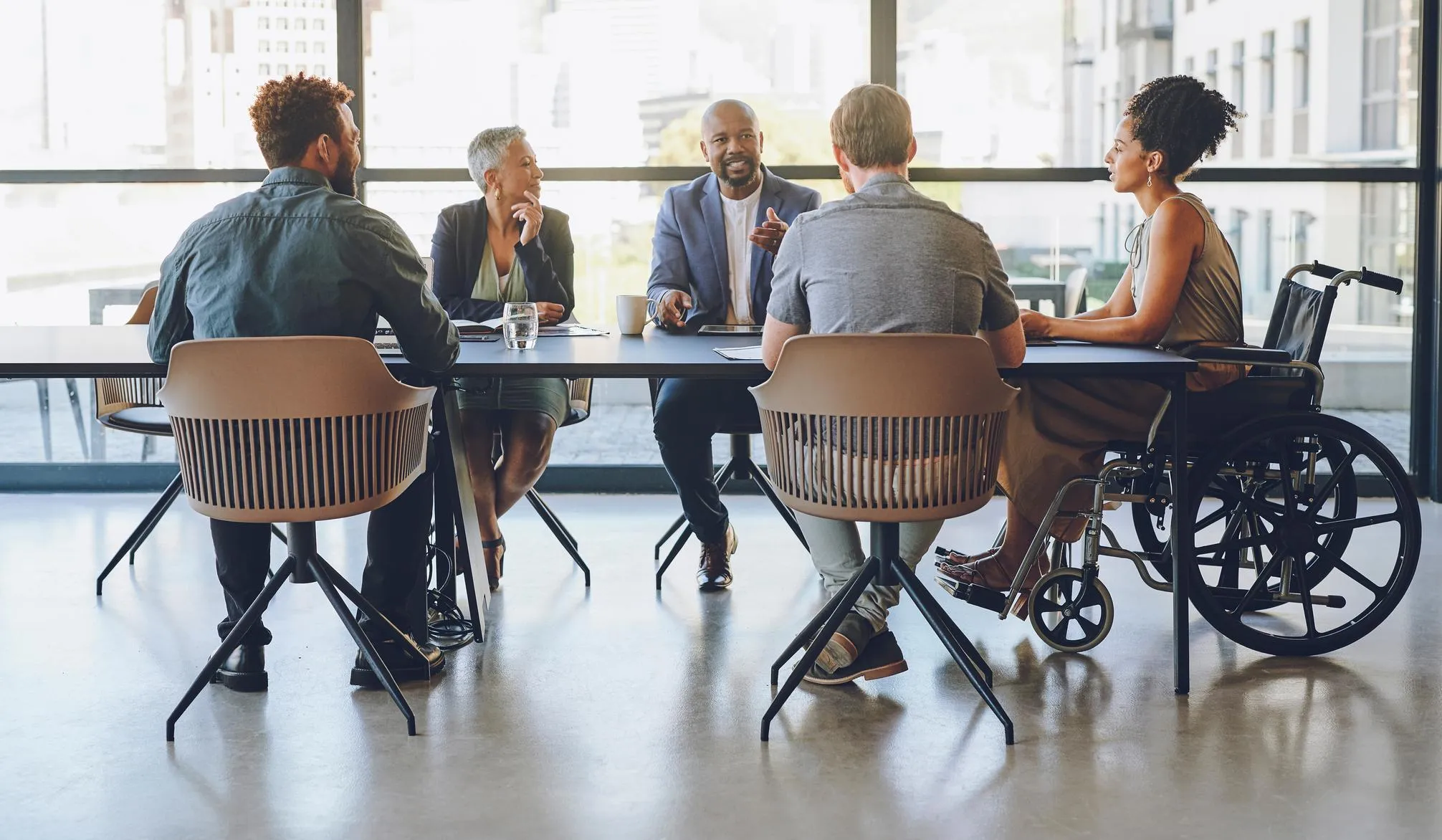 Diverse group of people sitting around a table in the office