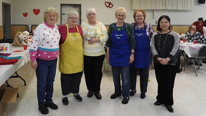 The Pythian Sisters, posing at a fundraiser, have been hosting barbecue events and other celebrations for more than 20 years to support diabetes research after one of the members granddaughters was diagnosed as a child.