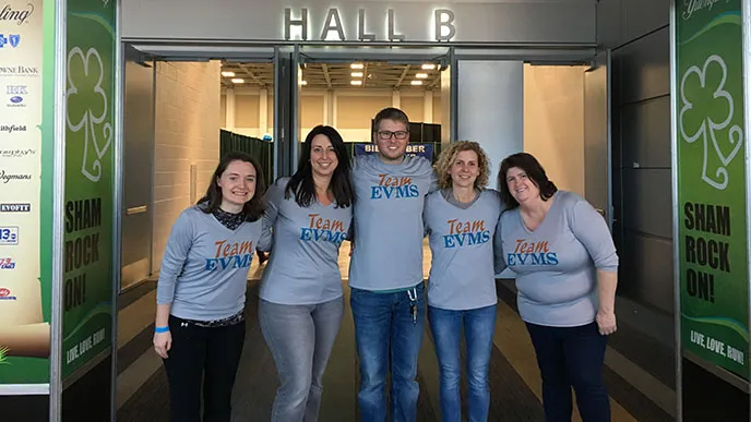 Team EVMS members pose for a photo at the Shamrock Marathon expo. Each year, Team EVMS raises funds for cancer and diabetes research and participates in the Shamrock Marathon weekend, held each year on the weekend of March 17.