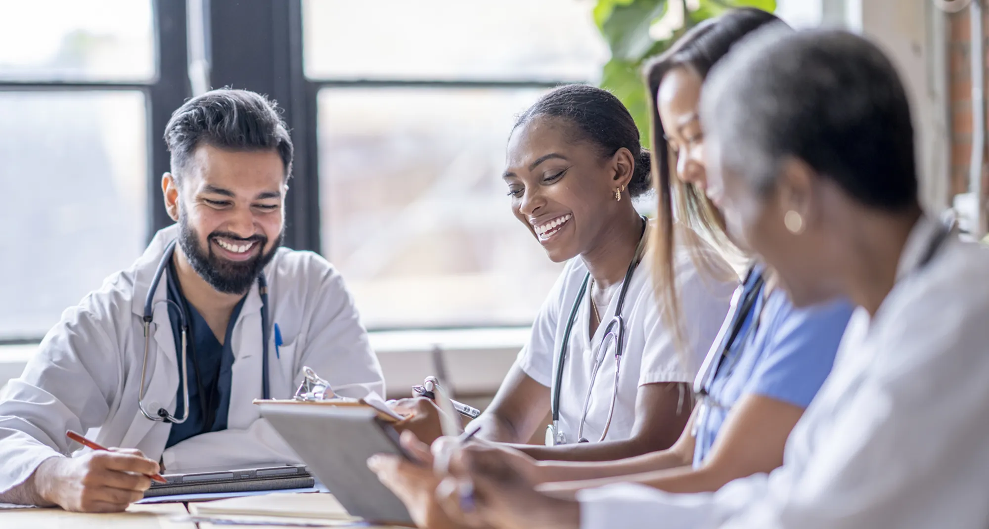 Doctors laughing in a meeting
