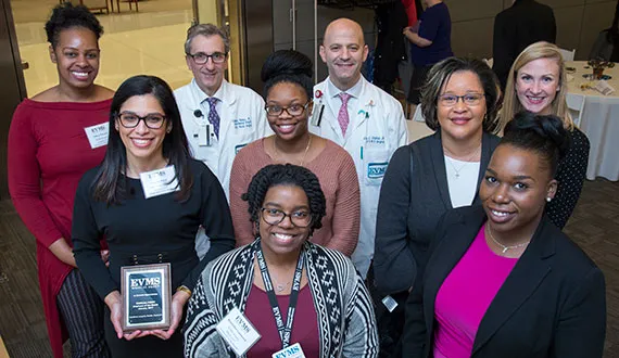 Employees of the Month from 2018 pose for a photo together.