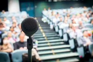 Microphone facing a large audience