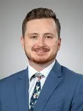A male doctor posing for a photograph