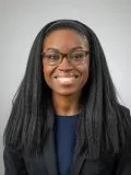 A female doctor posing for a photograph
