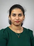 A female doctor posing for a photograph