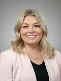 A female doctor posing for a photograph