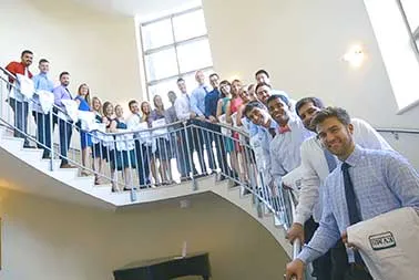 Students show off their white coats. The EVMS Medical Master's Program has helped 85-90% of our students successfully place into the entering classes of more than 60 medical schools across the country.