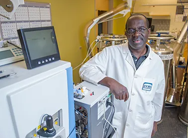 Dr. Julius Nyalwidhe poses in the laboratory.