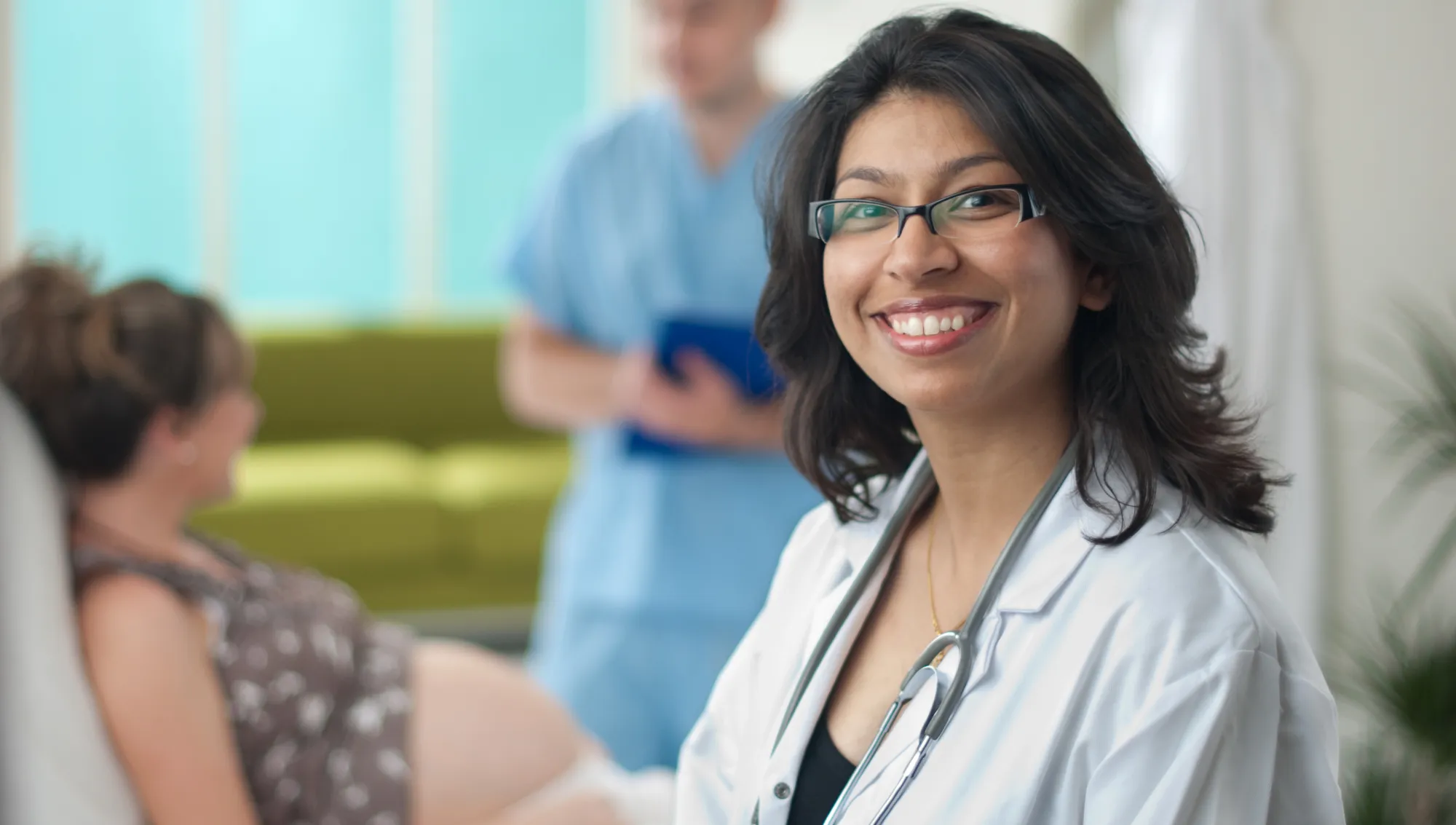 Female hospitalist in foreground