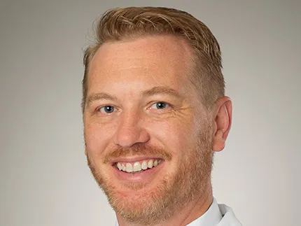 Portrait of a male doctor smiling at the camera