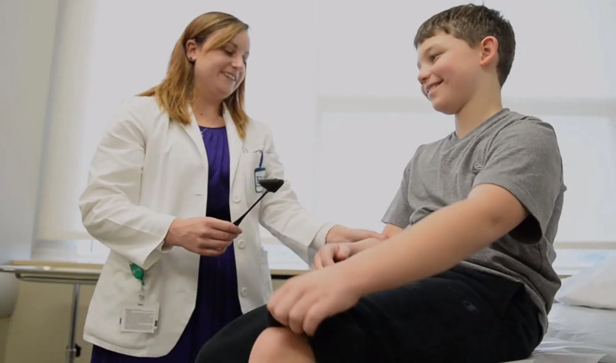 A fellow works with a 10-year-old standardized patient at EVMS.