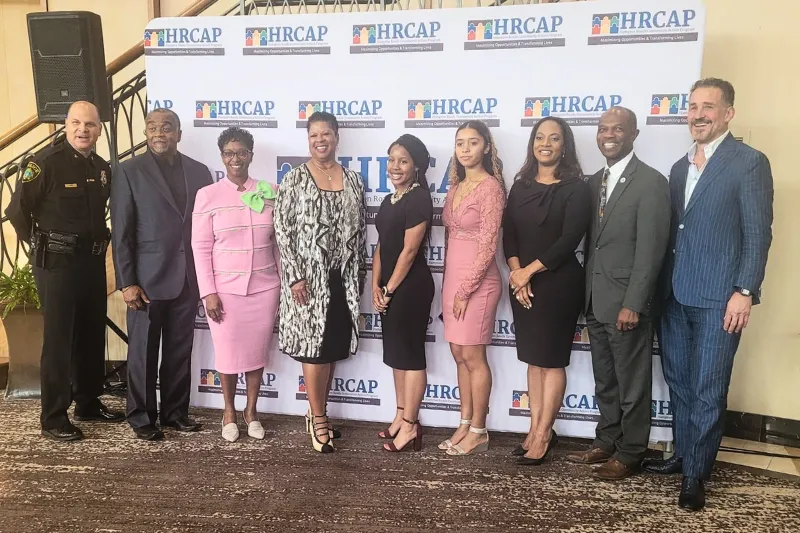 Ethlyn McQueen-Gibson stands with other recipients of the Community Builders Award