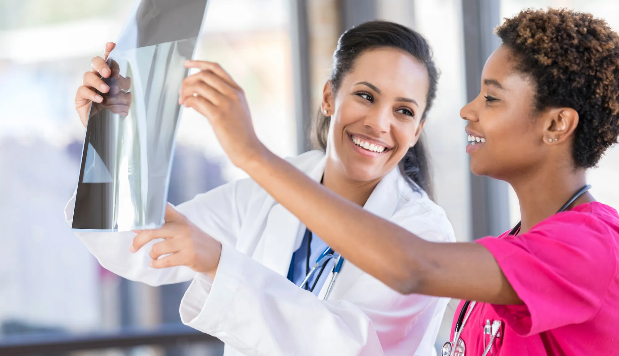 A radiologist consults with another member of the medical team.
