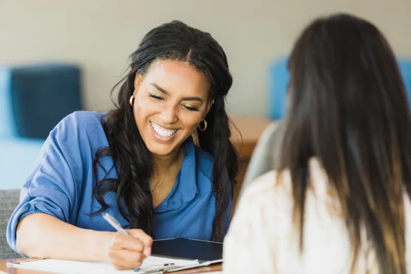Female smiling during an interview