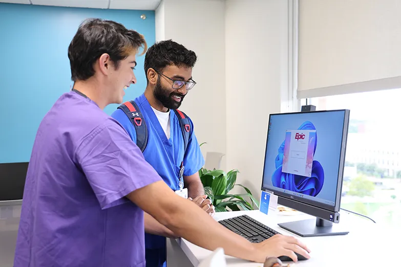 students looking at a computer