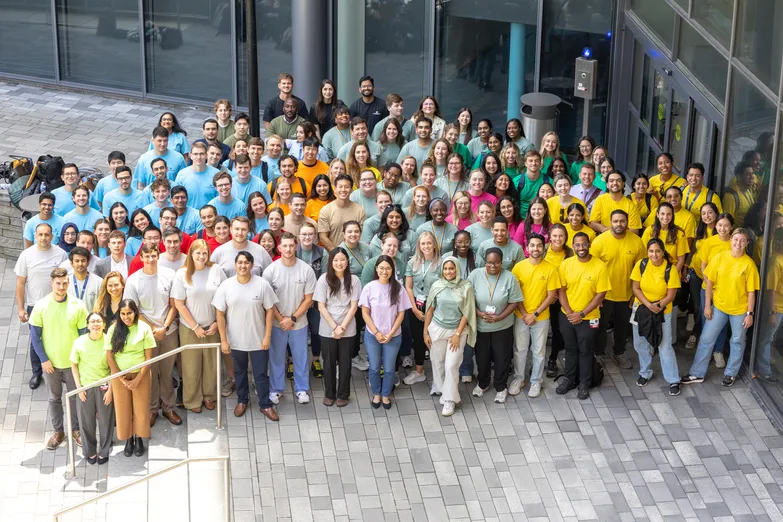 group of students on sidewalk looking towards camera