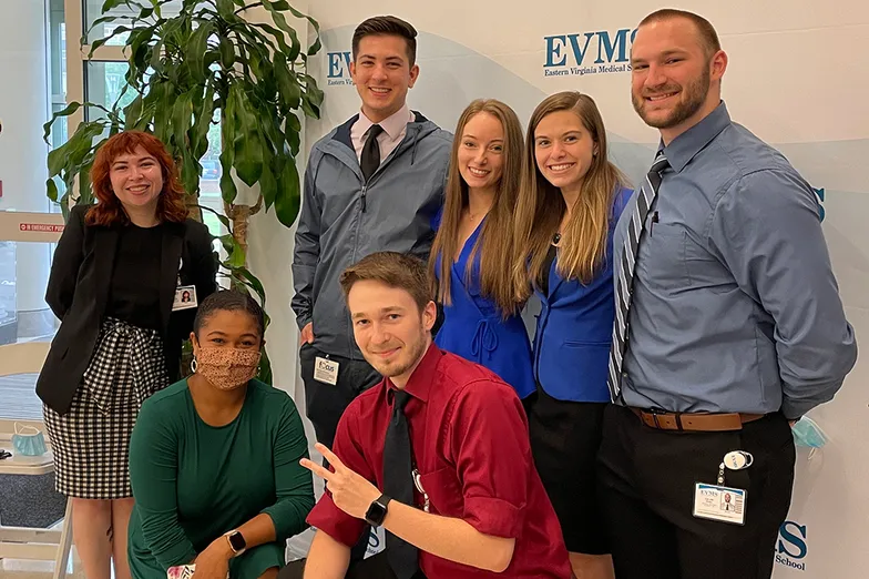 students posing for a photo on campus