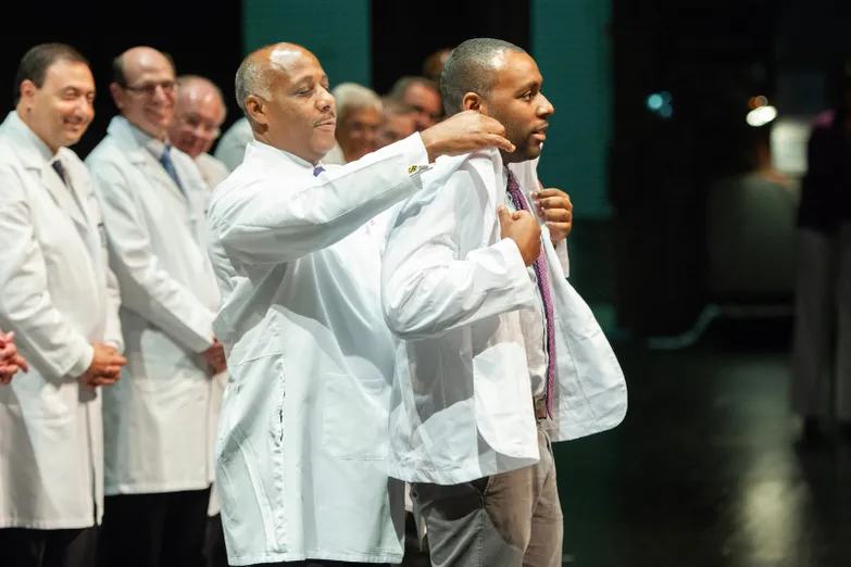 Derwin Gray is coated by his father