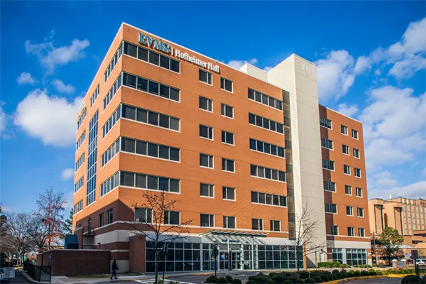 Hofheimer Hall is a 7-story brick building with glass-covered entrance.